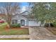 House exterior with a white garage door and red mulch at 6621 Bouganvillea Crescent Dr, Orlando, FL 32809