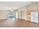 Bright living room features wood-look floors and sliding glass doors leading to the backyard at 6621 Bouganvillea Crescent Dr, Orlando, FL 32809