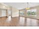 Spacious living room with wood-look floors and lots of natural light at 6621 Bouganvillea Crescent Dr, Orlando, FL 32809