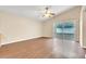 Spacious living area with wood-look floors and access to the backyard at 6621 Bouganvillea Crescent Dr, Orlando, FL 32809