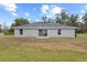 Newly built home with a backyard and sliding glass doors at 258 Fraser Rd, Debary, FL 32713