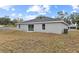 Newly built home with a backyard and sliding glass doors at 258 Fraser Rd, Debary, FL 32713