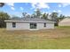 Newly built home with a backyard and sliding glass doors at 258 Fraser Rd, Debary, FL 32713