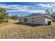 Newly built home with a large backyard, sliding glass doors, and AC unit at 258 Fraser Rd, Debary, FL 32713