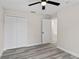 Bedroom with grey flooring, double door closet and an additional door at 258 Fraser Rd, Debary, FL 32713