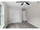 Bedroom with double door closet and wood-look flooring at 258 Fraser Rd, Debary, FL 32713