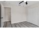 Spacious bedroom featuring grey vinyl flooring and ample closet space at 258 Fraser Rd, Debary, FL 32713