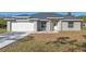 Newly constructed home with gray exterior, white garage door, and stone accents at 258 Fraser Rd, Debary, FL 32713