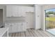 White shaker cabinets and quartz countertops in a bright kitchen at 258 Fraser Rd, Debary, FL 32713