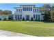 Stunning two-story home with a manicured lawn and a balcony, perfect for enjoying the outdoors at 1948 Rowena Ave, Orlando, FL 32803