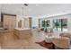 Open living room with kitchen, fireplace, and sliding doors to outdoor living at 1948 Rowena Ave, Orlando, FL 32803