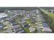 This aerial view showcases the home in relation to the neighborhood at 4694 Monica St, The Villages, FL 32163