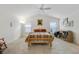 Spacious main bedroom with vaulted ceiling, two windows, carpeted floor, and ceiling fan at 4694 Monica St, The Villages, FL 32163