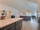 Spacious open floor plan connecting the kitchen, living room, and dining areas at 4694 Monica St, The Villages, FL 32163