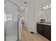 Bathroom featuring a glass enclosed shower, granite-topped vanity, tile flooring, and bright natural light at 489 Avila Pl, Howey In The Hills, FL 34737