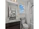 Bright bathroom features a granite countertop vanity and a shower-tub combo with white tile surround at 489 Avila Pl, Howey In The Hills, FL 34737