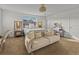 Bright bedroom featuring a stylish sofa, complemented by modern decor and soft lighting at 489 Avila Pl, Howey In The Hills, FL 34737