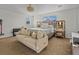 Luxurious bedroom featuring a elegant sofa, complemented by modern decor and soft lighting at 489 Avila Pl, Howey In The Hills, FL 34737