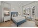 Bedroom featuring a vanity, chair, carpet, and windows with lots of natural light at 489 Avila Pl, Howey In The Hills, FL 34737