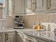 Bright kitchen featuring ample counter space, custom cabinetry, and stainless steel appliances at 489 Avila Pl, Howey In The Hills, FL 34737