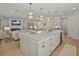 Open concept kitchen with a large center island, pendant lighting and stainless steel appliances at 489 Avila Pl, Howey In The Hills, FL 34737