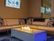Outdoor patio with comfortable seating, a modern fire pit, and stylish decor at 489 Avila Pl, Howey In The Hills, FL 34737