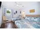 Bright bedroom with two twin beds, matching decor, and a cozy atmosphere at 577 Sunridge Woods Blvd, Davenport, FL 33837