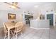 Bright kitchen and breakfast nook with stylish cabinets and stainless steel appliances at 577 Sunridge Woods Blvd, Davenport, FL 33837