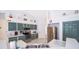 Modern kitchen with stainless steel appliances and bright white countertops at 577 Sunridge Woods Blvd, Davenport, FL 33837