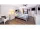 Comfortable main bedroom with a large bed, bedside tables, and ample natural light at 577 Sunridge Woods Blvd, Davenport, FL 33837