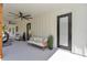 Relaxing back porch with sofas, ceiling fans, and view of green yard at 12009 Sw 61St Place Road, Ocala, FL 34481