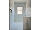 Bathroom under construction featuring stylish tile work, a niche, and a window at 12009 Sw 61St Place Road, Ocala, FL 34481