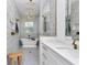 Elegant bathroom featuring a standalone tub, high-end finishes, decorative tile, and brass fixtures at 12009 Sw 61St Place Road, Ocala, FL 34481