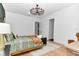 Bright bedroom featuring modern ceiling fan, wood floors, and natural light at 12009 Sw 61St Place Road, Ocala, FL 34481