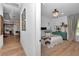 Cozy bedroom with board and batten accent wall, decorative chandelier, and comfortable decor at 12009 Sw 61St Place Road, Ocala, FL 34481