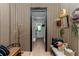 Hallway with wooden paneling, a storage bench and decorated with vintage accessories at 12009 Sw 61St Place Road, Ocala, FL 34481