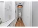 Bright hallway features built-in custom cabinetry, storage, and hardwood floors at 12009 Sw 61St Place Road, Ocala, FL 34481