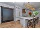 Elegant kitchen with an oversized island, white cabinets, luxury appliances, and zebra print seating at 12009 Sw 61St Place Road, Ocala, FL 34481
