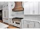 Modern kitchen featuring white cabinetry, gold hardware, and state-of-the-art appliances at 12009 Sw 61St Place Road, Ocala, FL 34481