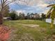 Large backyard with mature trees and shed at 2906 4Th St, Orlando, FL 32820