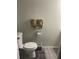 Small bathroom with toilet and wall mounted towel rack at 2906 4Th St, Orlando, FL 32820