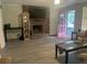 Living room featuring a brick fireplace and plenty of natural light at 2906 4Th St, Orlando, FL 32820