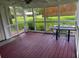 Relaxing screened porch with table and chairs at 2906 4Th St, Orlando, FL 32820