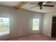 Bedroom with two windows, carpet and ceiling fan at 3009 Manatee Rd, Tavares, FL 32778