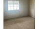 Bright bedroom with neutral walls and carpet at 3009 Manatee Rd, Tavares, FL 32778