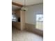 Dining area with light colored cabinets and tile floor at 3009 Manatee Rd, Tavares, FL 32778