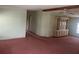 Spacious living room with pink carpet and wood beam at 3009 Manatee Rd, Tavares, FL 32778