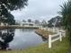 Community view of homes near a pond at 3009 Manatee Rd, Tavares, FL 32778