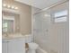 Clean bathroom with a shower/tub combo and white vanity at 8009 Applehill Ct, Orlando, FL 32810