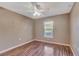 Bright bedroom with wood floors and a large window at 8009 Applehill Ct, Orlando, FL 32810